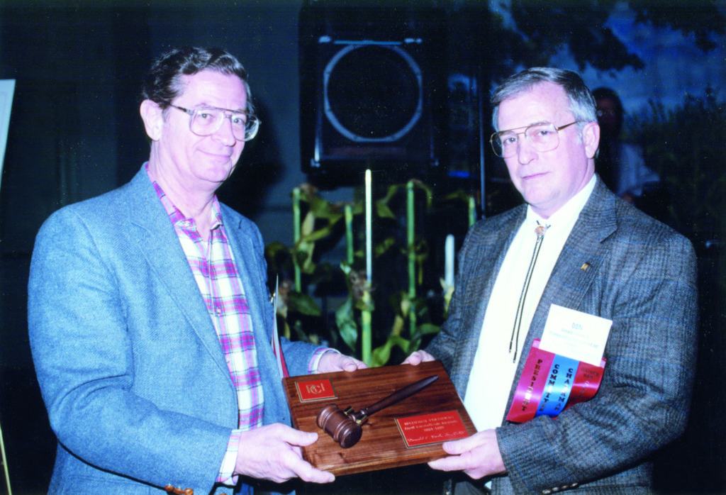 Don passes the president’s gavel to Dick Horowitz in 1992.