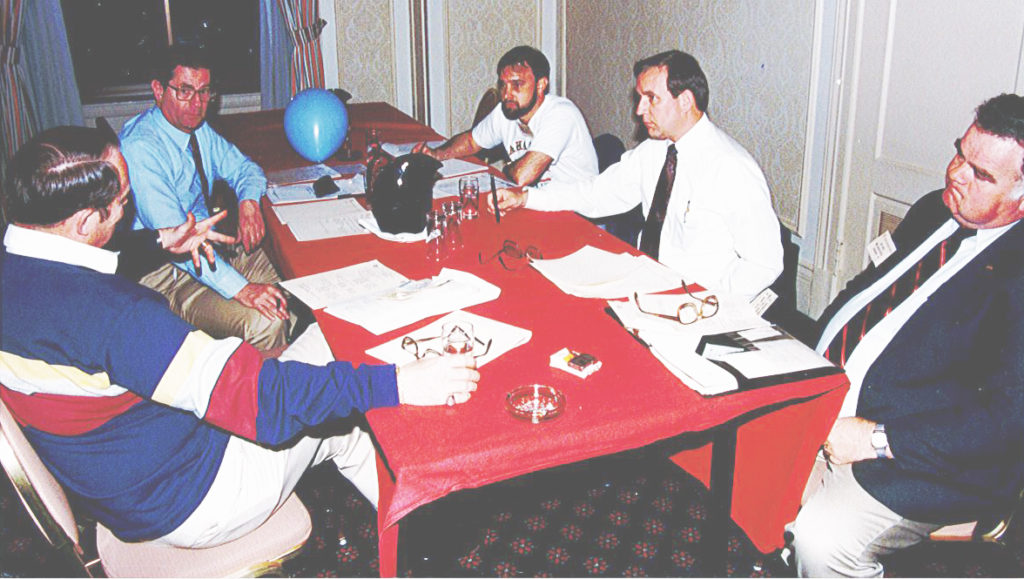 Don Bush (second from right) and others discuss RCI business, 1996. Left to right: Bob Martin, Dick Horowitz, Warren French, Don Bush, and Joe Hale.