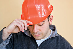 Sad construction worker