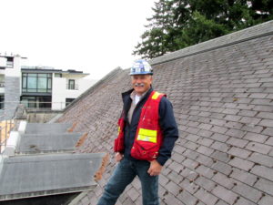 Klein standing on a roof