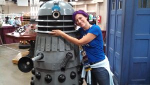 Katey hugs a Dalek, from the science fiction TV show "Doctor Who."