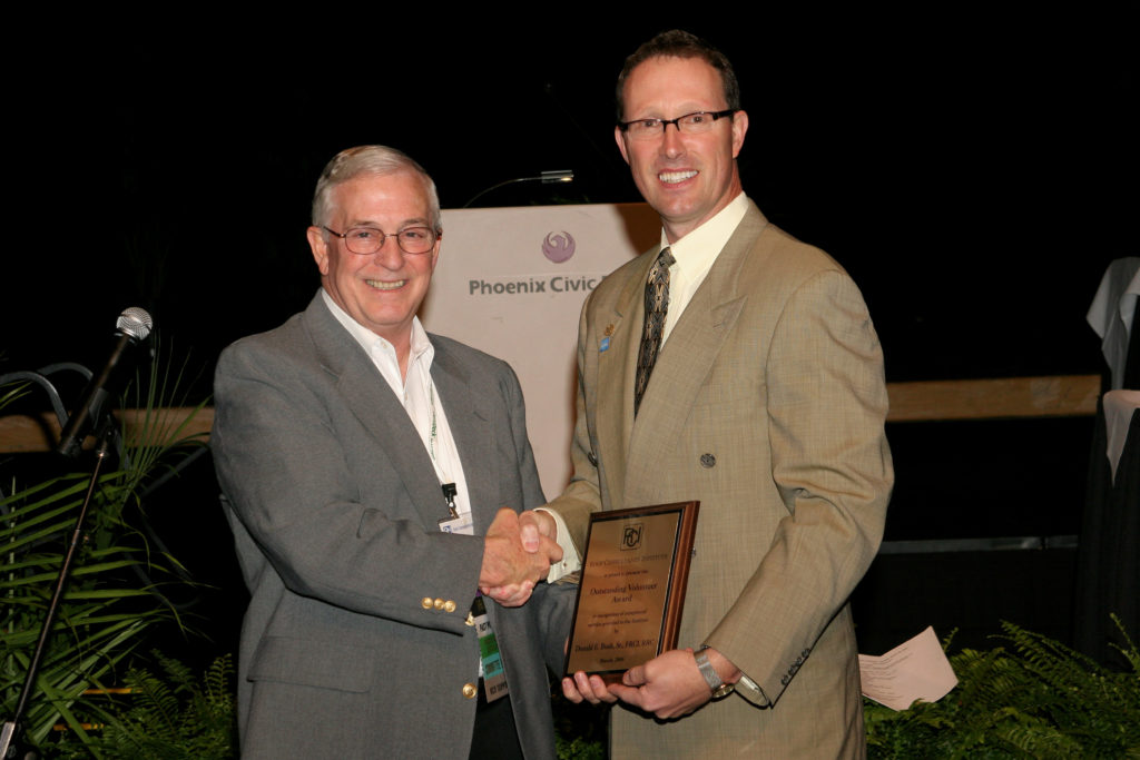 Don receives the Outstanding Volunteer Award at the 2006 convention from President Tom Hutchinson.