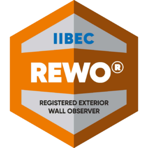 Orange and silver hexagonal badge for IIBEC's REWO credential.