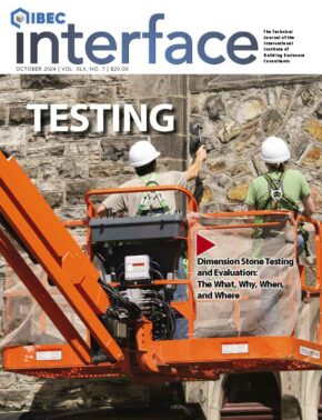 Cover of the October issue of IIBEC Interface showing workers in hardhats on the side of a building representing, 