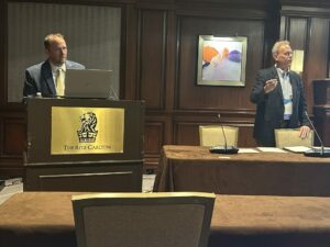 A photo from Building Innovation 2025 shows Dale Crawford (left) and Casey Robb.
