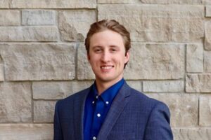 Miles Springer in a blue shirt and sport coat