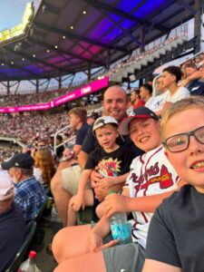 Bryce with his sons Luke, Wyatt, and Harrison at an Atlanta Braves game.