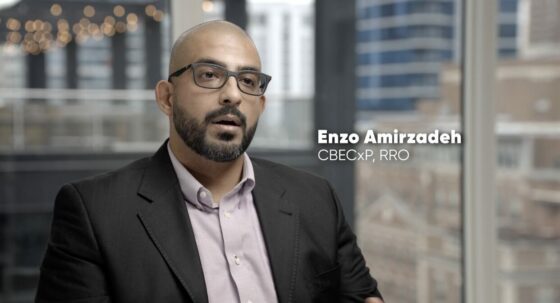 Enzo Amirzadeh, in a sport jacket and button down shirt, explains building commissioning.