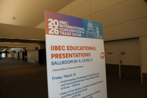 A sign highlighting IIBEC education sessions.