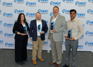 Holding their EBEC Awards, left to right, are Jennifer Hogan, Christopher Grey, Christopher Giffin, and Milirsan Pugalendiran.