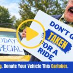 Man with a mustache holds a sign that reads 'Don't get taken for a ride' beside a car with 'Top $$$' and 'Today's Special' signs, plus a QR code; a video play overlay suggests a PSA about vehicle scams and donations.