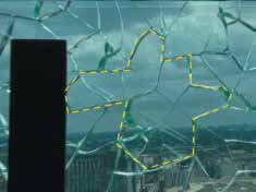 Underwater view through a cracked glass pane with a yellow dashed line tracing a path across the shards.