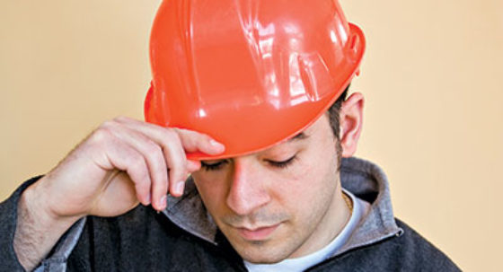 Sad construction worker