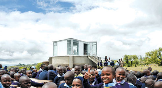 children in front of library