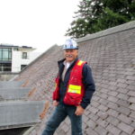 Klein standing on a roof