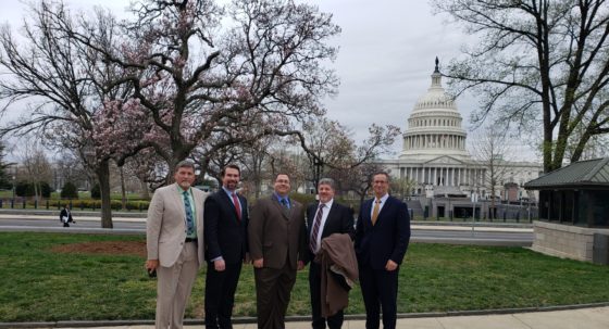 Five RCI leaders standing in front of the Capitol